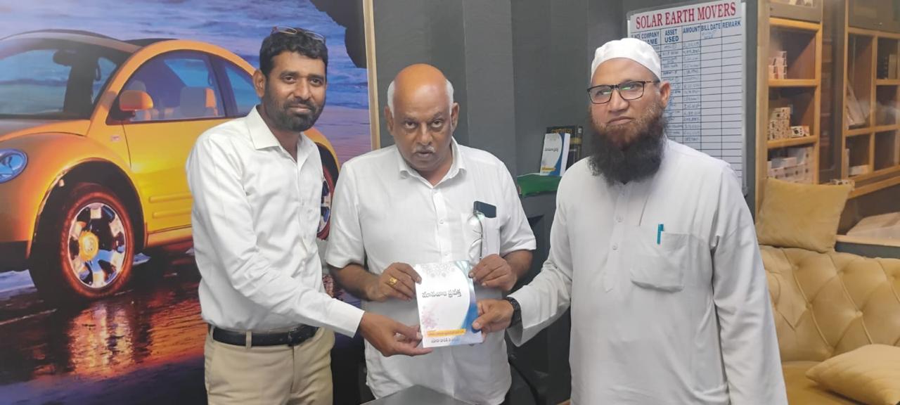 Handover of educational booklets at a community event